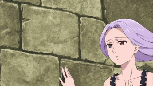 a woman with purple hair stands in front of a brick wall