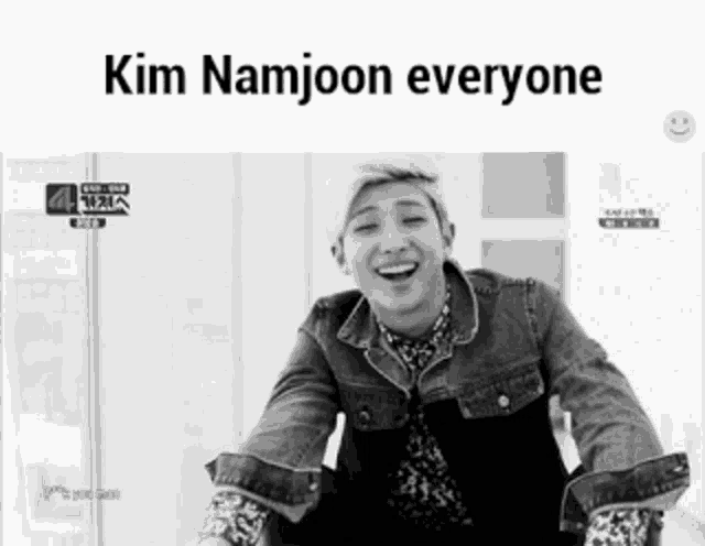 a black and white photo of a man laughing with the caption kim namjoon everyone