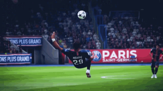 a soccer player in a paris saint-germain jersey jumps to catch a ball