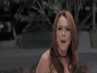 a woman with red hair has the words it 's not written on her face