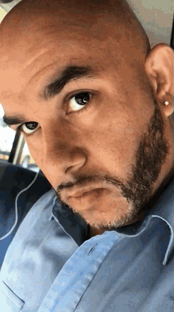 a close up of a man 's face with a beard