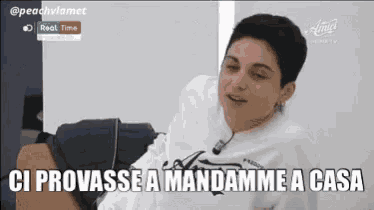 a woman is sitting on a chair with the words ci provasse a mandamme a casa written on the bottom