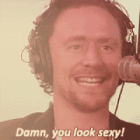 a man wearing headphones is smiling and says damn you look sexy