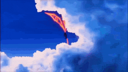 a plane is flying through a cloudy blue sky with a flame coming out of it