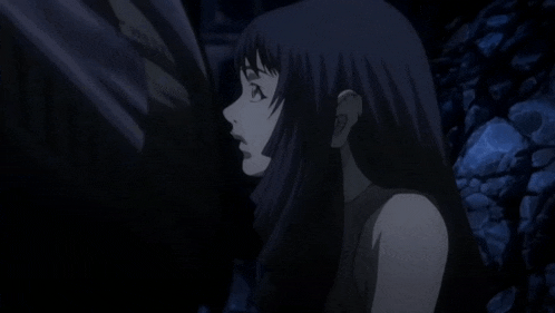 a woman with long dark hair is standing in the dark with her eyes closed