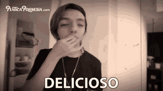 a black and white photo of a young man with the words delicioso written on the bottom