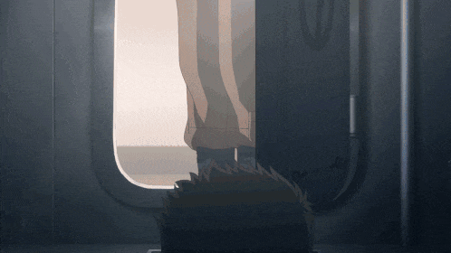 a person is standing in a doorway with their feet out