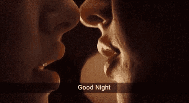 a close up of a man and woman kissing with the words `` good night '' written on the bottom .