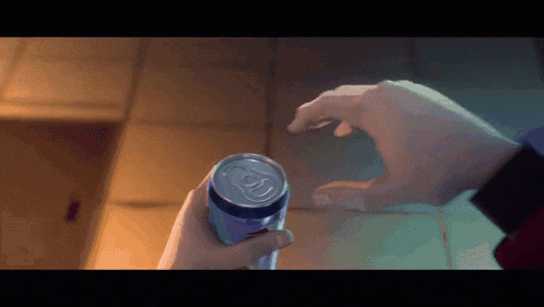 a person is holding a can of diet pepsi
