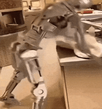 a robot is cleaning a table with a cloth .