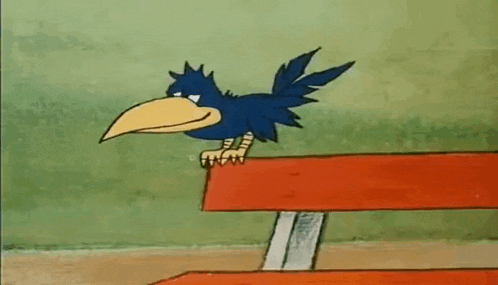 a blue bird with a yellow beak is sitting on top of a red bench .