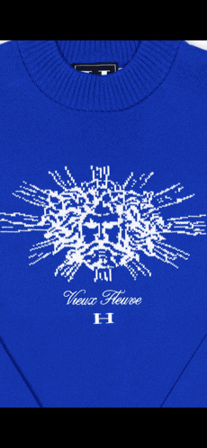 a blue sweater with the word vieux fleurs on it