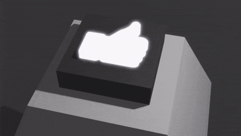a black box with a white thumbs up sign on top of it