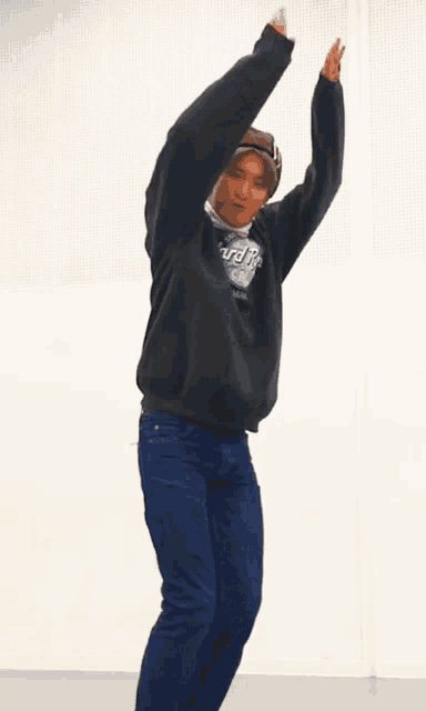 a man wearing a hard rock cafe sweatshirt