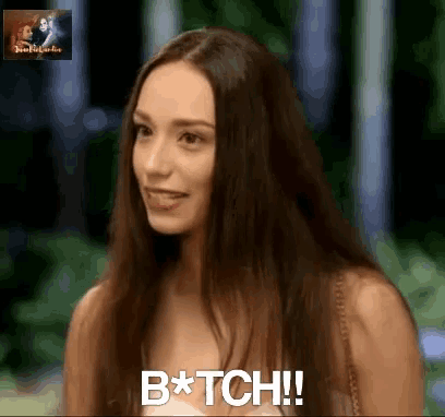 a woman with long hair is smiling and saying bitch !