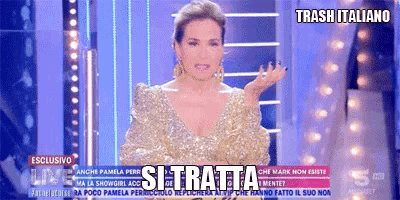 a woman in a gold dress stands in front of a sign that reads trash italiano