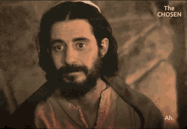 a man with a beard is on a screen with the words the chosen ah