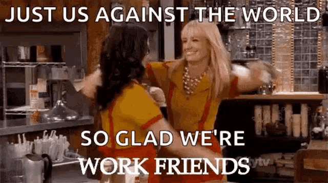 two women are hugging each other in a restaurant and they are against the world .