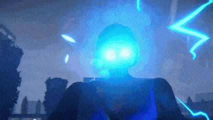 a person is standing in front of a lightning bolt with a blue light shining on their face .
