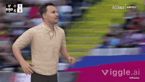 a man is running on a soccer field with a viggle.ai logo in the background