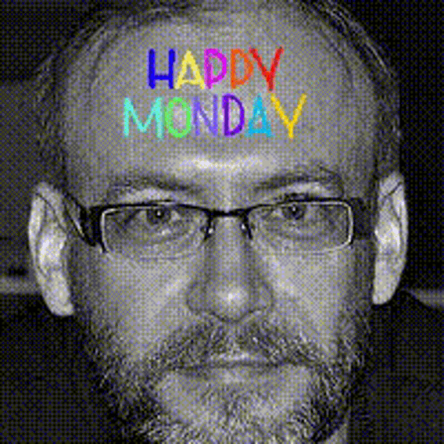 a man with glasses and a beard has the words happy monday painted on his forehead