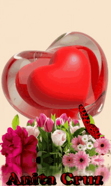 a red heart in a glass surrounded by pink flowers