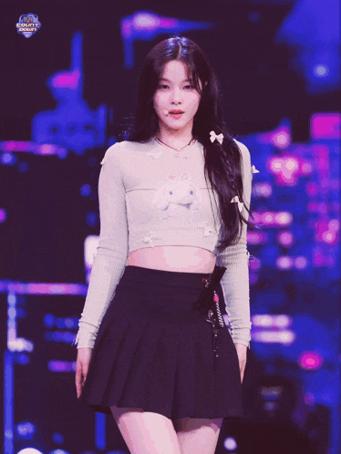 a girl wearing a crop top and a pleated skirt is surrounded by bows
