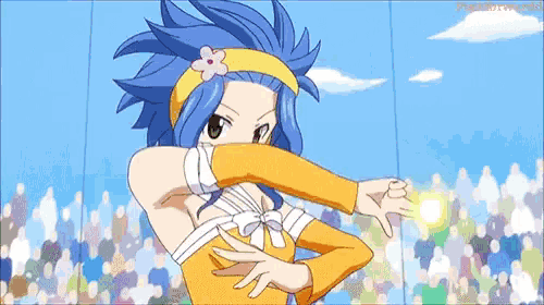 a girl with blue hair and a flower in her hair is standing in front of a crowd .