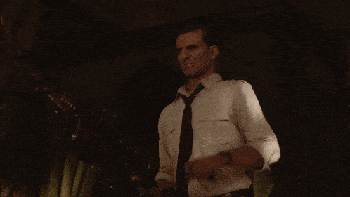 a man in a tie is holding a gun
