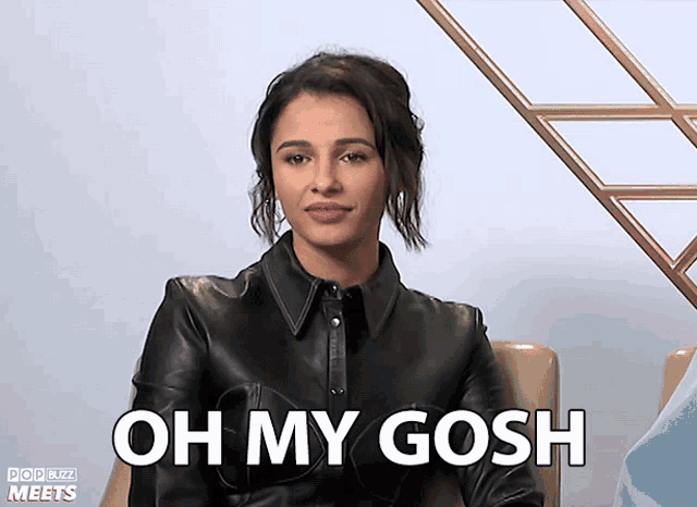 a woman wearing a black leather jacket says oh my gosh