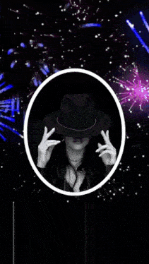 a woman in a hat is surrounded by fireworks in the background
