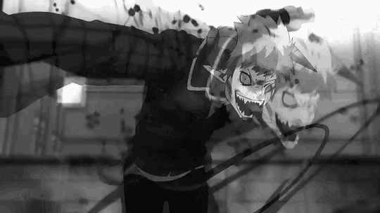 a black and white photo of a cartoon character with fangs .