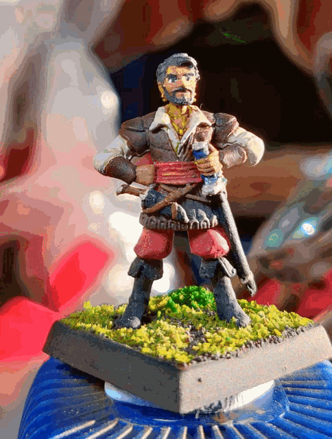a figurine of a man with a beard holding a bottle