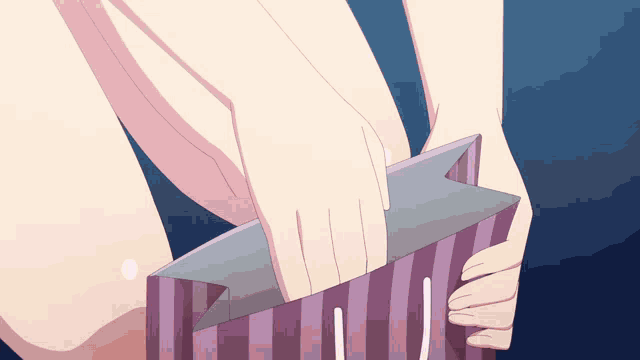 a person is holding a striped bag that says ' j ' on it
