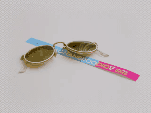 a pair of sunglasses with a lanyard that says chanbroaddict