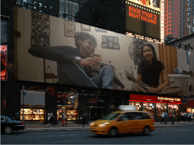a billboard with a picture of a man and a woman says book your 2 night package