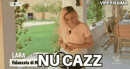 a woman is standing on a porch with her hands on her hips and a sign that says lara nu cazz .