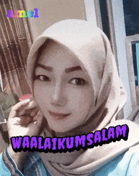 a woman wearing a hijab with the words waalaikumsalam written below her