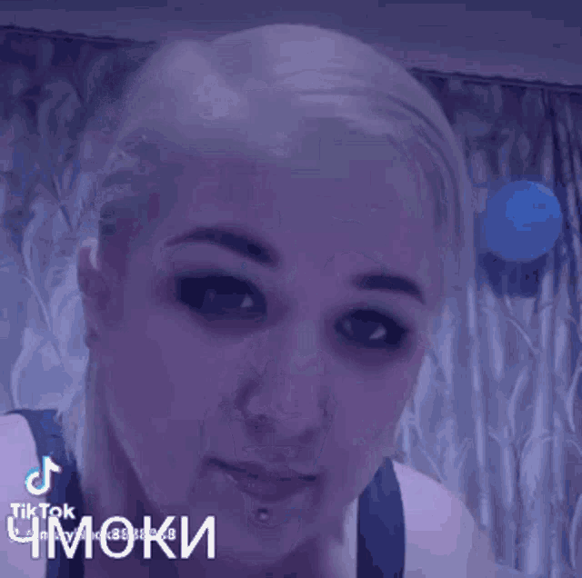 a tiktok video of a woman blowing bubbles in her mouth