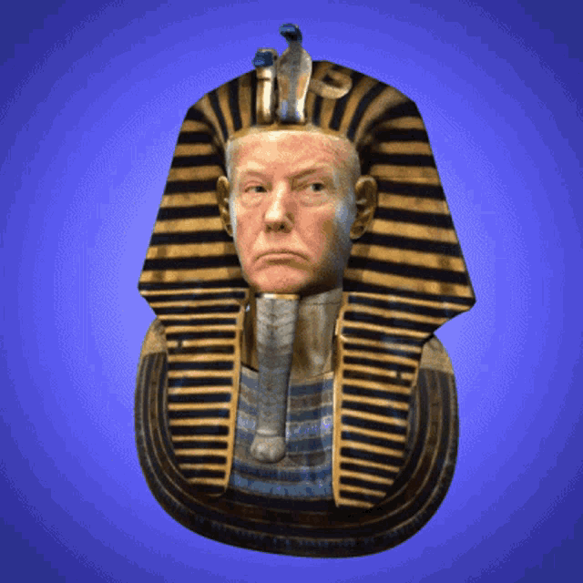 a statue of a pharaoh with a trump face on it