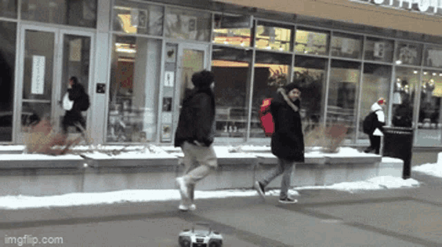 a group of people are walking in front of a building that says imgflip.com on the bottom