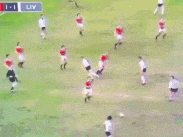 a soccer game is being played in a stadium with a sign that says liv in the corner