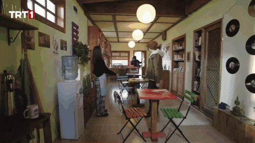 a room with tables and chairs and a sign that says trt1 on it