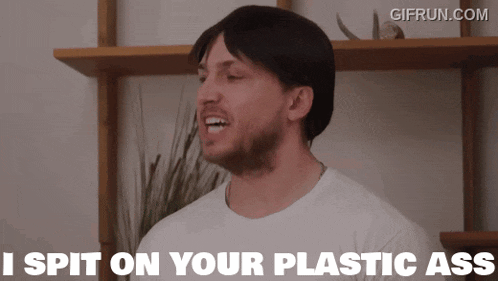 a man says i spit on your plastic ass in front of a shelf