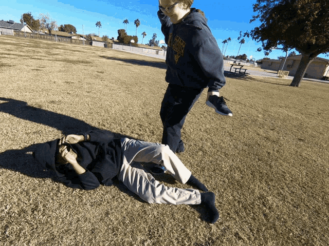a person wearing a sweatshirt that says university of california