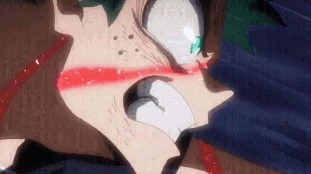 a close up of a person 's face with a red stripe on it and a green eye .