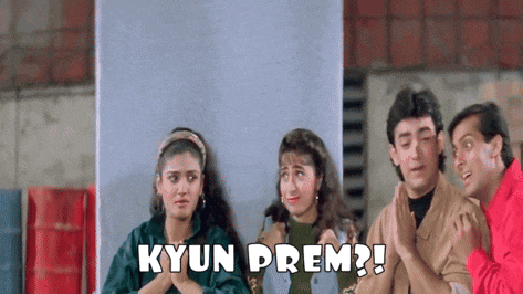 a group of people are standing in front of a wall with the words kyun prem written on the bottom