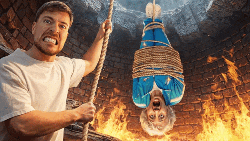a man is holding a rope while a woman is tied up in a fire pit