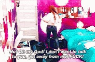 a girl is standing in a messy room and says no oh my god i don t want to talk to you get away from me