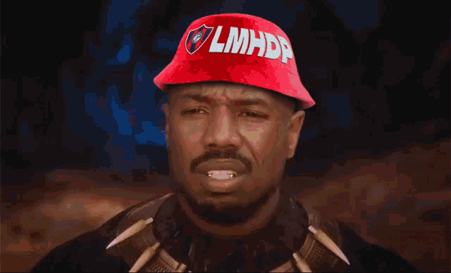 a man wearing a red hat with lmhdp written on it